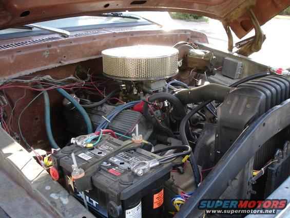 Brown 1977 Ford F-150 engine bay with dual batteries and aftermarket air filter