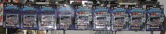 Collection of boxed model cars, some appearing to be trucks