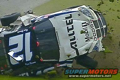Upside down race car with 'DODGE' and 'ALLTEL' visible