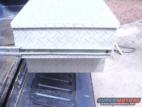 trunkmountexterior.jpg The heads of the mounting bolts were ground thinner to allow them to slide into the mounting rails.