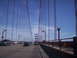 1989 Ford Bronco - View from a vehicle crossing the Golden Gate Bridge, with multiple cars on the roadway.