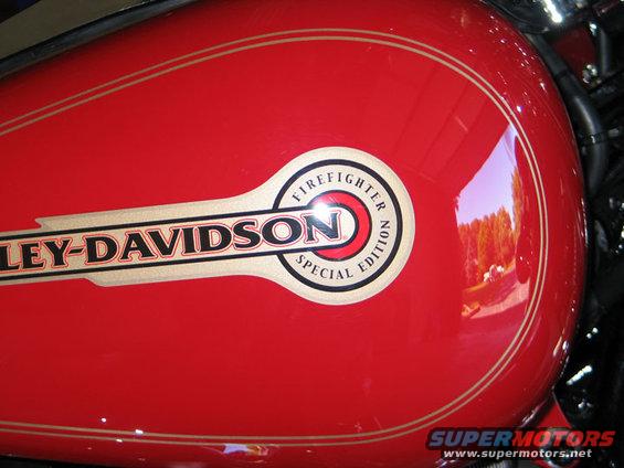 Red Harley-Davidson gas tank with 'Firefighter Special Edition' emblem