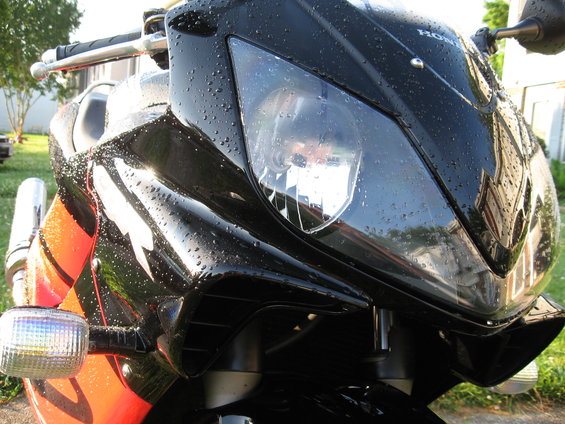 Black 2004 Honda CBR600F front with water droplets