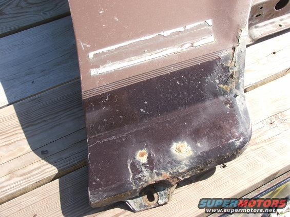 Brown fender with rust and horizontal stripe trim