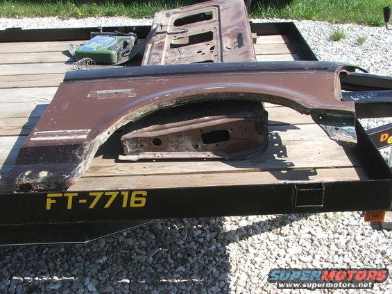 Brown fender and door parts on a trailer with FT-7716 marking