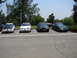 1992 Ford Taurus - Four Ford Taurus sedans are parked in a lot on a sunny day.