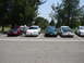 1992 Ford Taurus - Several Ford Taurus sedans are parked in a lot on a sunny day.