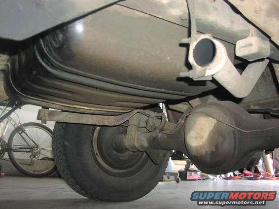 Undercarriage view of a vehicle's rear axle and fuel tank