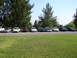 1992 Ford Taurus - Several sedans are parked in a lot, with a 1992 Ford Taurus among them.