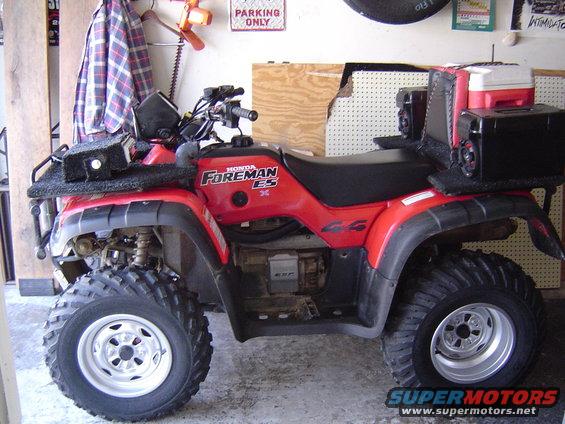 Red Honda Foreman ES ATV with cooler and storage boxes on rear rack