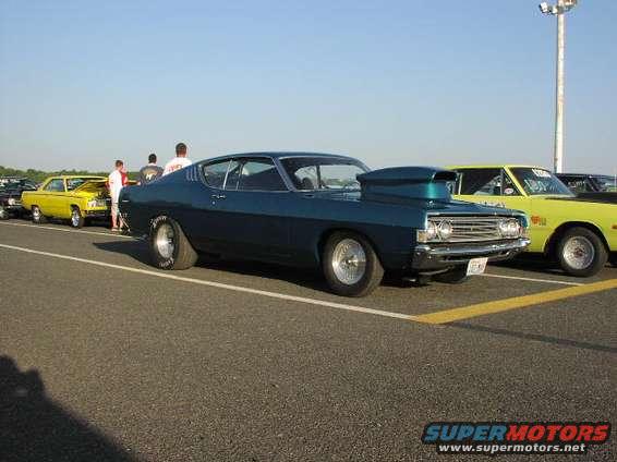 Blue 1969 Ford Torino GT drag car with scoop, side view
