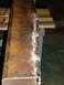 1989 Ford Bronco - Close-up of a rusty, welded metal beam, likely a custom part, with a Supermotors.net watermark.