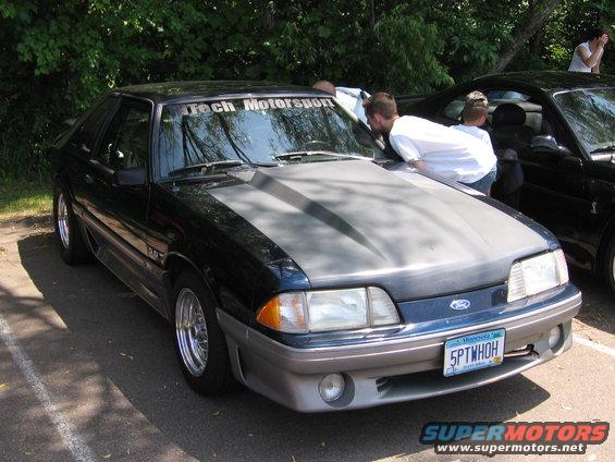 1989 Ford Mustang 3q-front view, dark blue with grey hood and aftermarket wheels