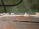 1989 Ford Bronco - Close-up of a welded metal seam, showing the weld beads and some surface rust.