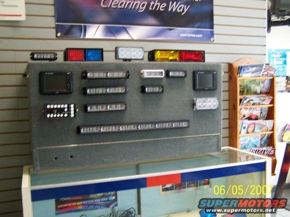 Display board with various LED light bars and modules, red, blue, white, and amber colors