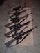 1995 Mercury Grand Marquis - Collection of rifles with scopes displayed on a rug.
