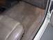 1995 Ford Taurus - Interior view of a 1995 Ford Taurus, highlighting the driver's seat and floor carpeting.