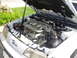 1995 Ford Taurus - The V8 engine of a 1995 Ford Taurus SHO is displayed with the hood open.