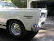 1973 Ford Ranchero - A white Ford Cyclone 390 is parked in front of a garage, with another vehicle visible inside.