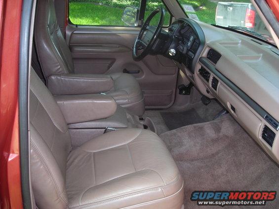 Tan leather seats and dashboard of a 1995 Ford Bronco, viewed from the passenger side