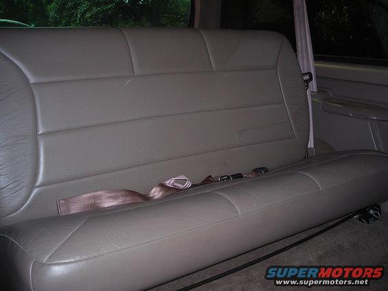 Tan leather rear bench seat with seatbelts in a 1995 Ford Bronco