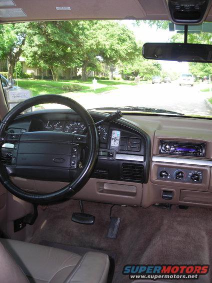 1995 Ford Bronco interior showing dashboard, steering wheel, and radio