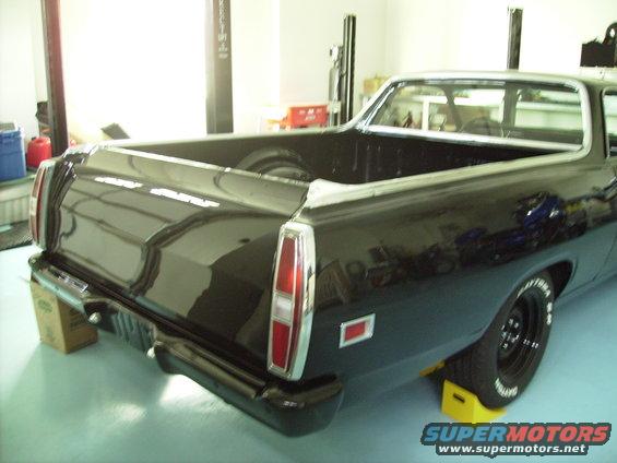 Black 1970 Ford Ranchero rear view. Red taillights and chrome bumper