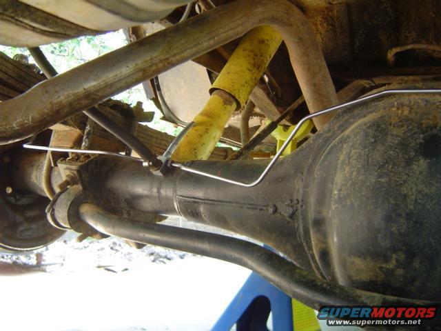 Rear axle and suspension with yellow shock absorber