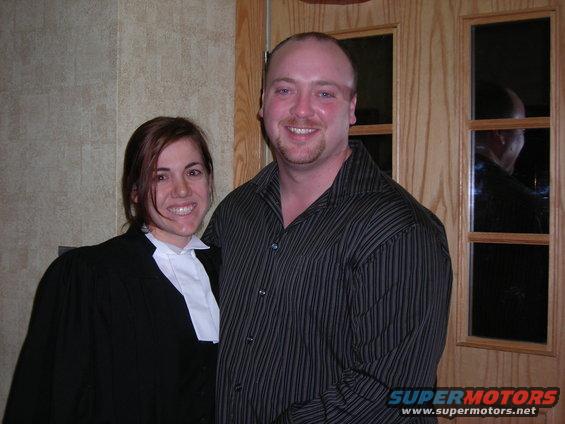 Man and woman smiling, woman wears judicial robes