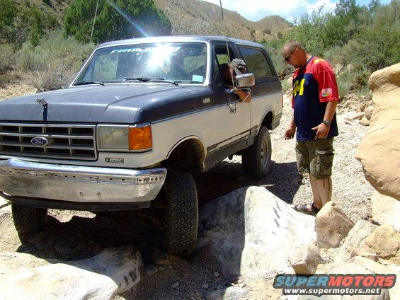 1987 Ford Bronco navigating rocky terrain