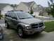 2004 Dodge Durango - A gray 2004 Dodge Durango SUV is parked in a suburban driveway.