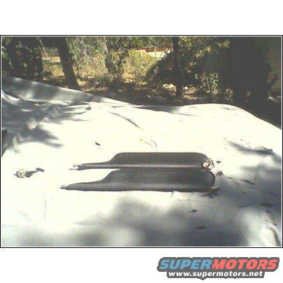 two car door seals laid out on a tarp