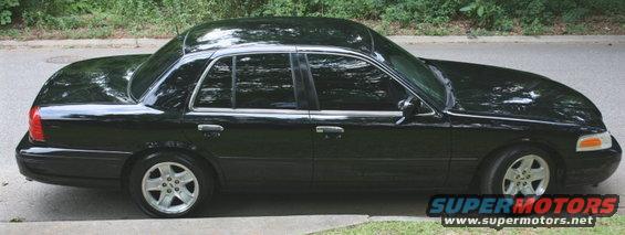 Black 2002 Ford Crown Victoria parked curbside