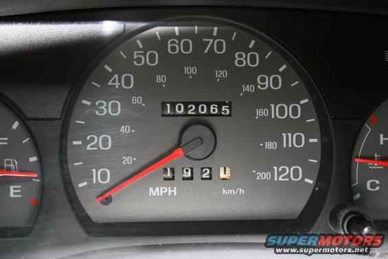 Car dashboard with speedometer, odometer showing 102065, and trip meter showing 192
