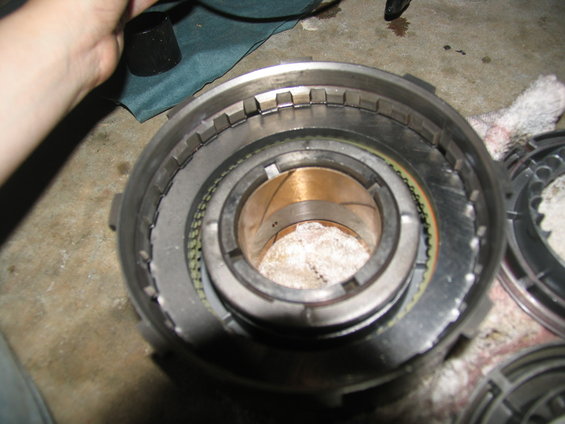 Close-up of a transmission clutch pack with metal plates and friction material