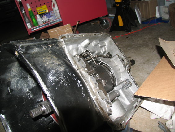 disassembled automatic transmission showing gears and torque converter components