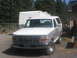 1994 Ford Bronco - This 1994 Ford Bronco is seen from the front, a chrome grille and white paint.