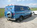 1978 Ford E250 - This 1978 Ford E250 van features a custom blue paint job and a spare tire cover with a horse and rider graphic.