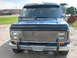 1978 Ford E250 - Front view of a blue 1978 Ford E250 van, a prominent chrome grille.