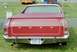 1976 Ford Ranchero - The rear of a red Ford Ranchero pickup truck is shown, with a New York license plate and "FORD" spelled out across the tailgate.