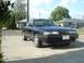 1989 Mazda MX-6 - A black 1989 Mazda MX-6 coupe is parked in a driveway with houses in the background.