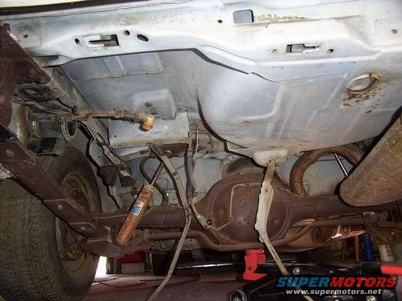 Gas tank removed, maybe it's time for new shocks.