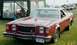 1976 Ford Ranchero - Red 1976 Ford Ranchero with a license plate from an unknown state.