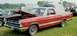 1976 Ford Ranchero - A red 1968 Ford Ranchero is displayed with its hood up at an outdoor event.