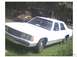 1991 Ford Crown Victoria - This 1991 Ford Crown Victoria sedan is shown from a 3/4 front angle, with the price "1400" written on its windshield.