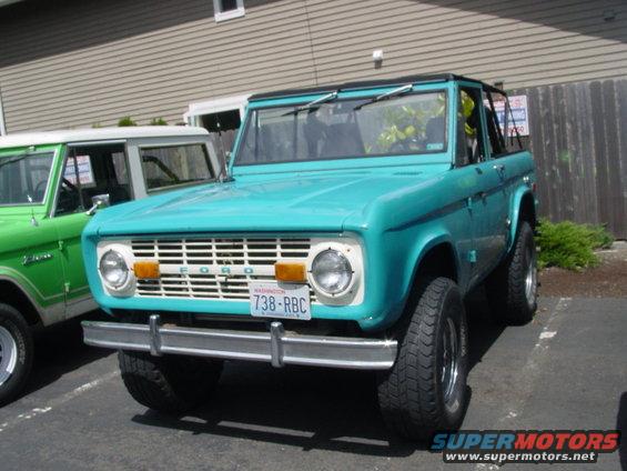 Turquoise 1973 Ford Bronco front view with Washington license plate 738-RBC