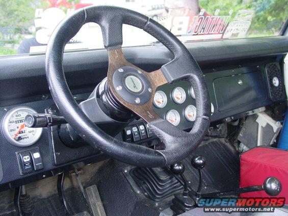 1973 Ford Bronco interior with custom steering wheel and gauges
