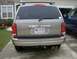 2004 Dodge Durango - The rear of a 2004 Dodge Durango is shown, dual exhaust pipes and a roof rack.