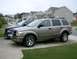 2004 Dodge Durango - This 2004 Dodge Durango is parked in a suburban driveway next to a blue pickup truck.