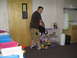 1988 Ford Bronco - A man is seen packing a bag in a room with storage bins and shelves.